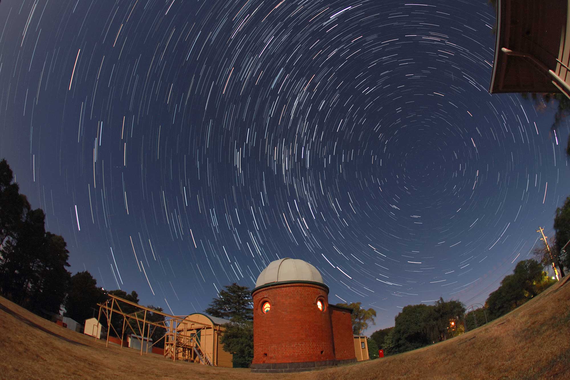 Star trails around the south celestial pole above the Jelbart Dome Building